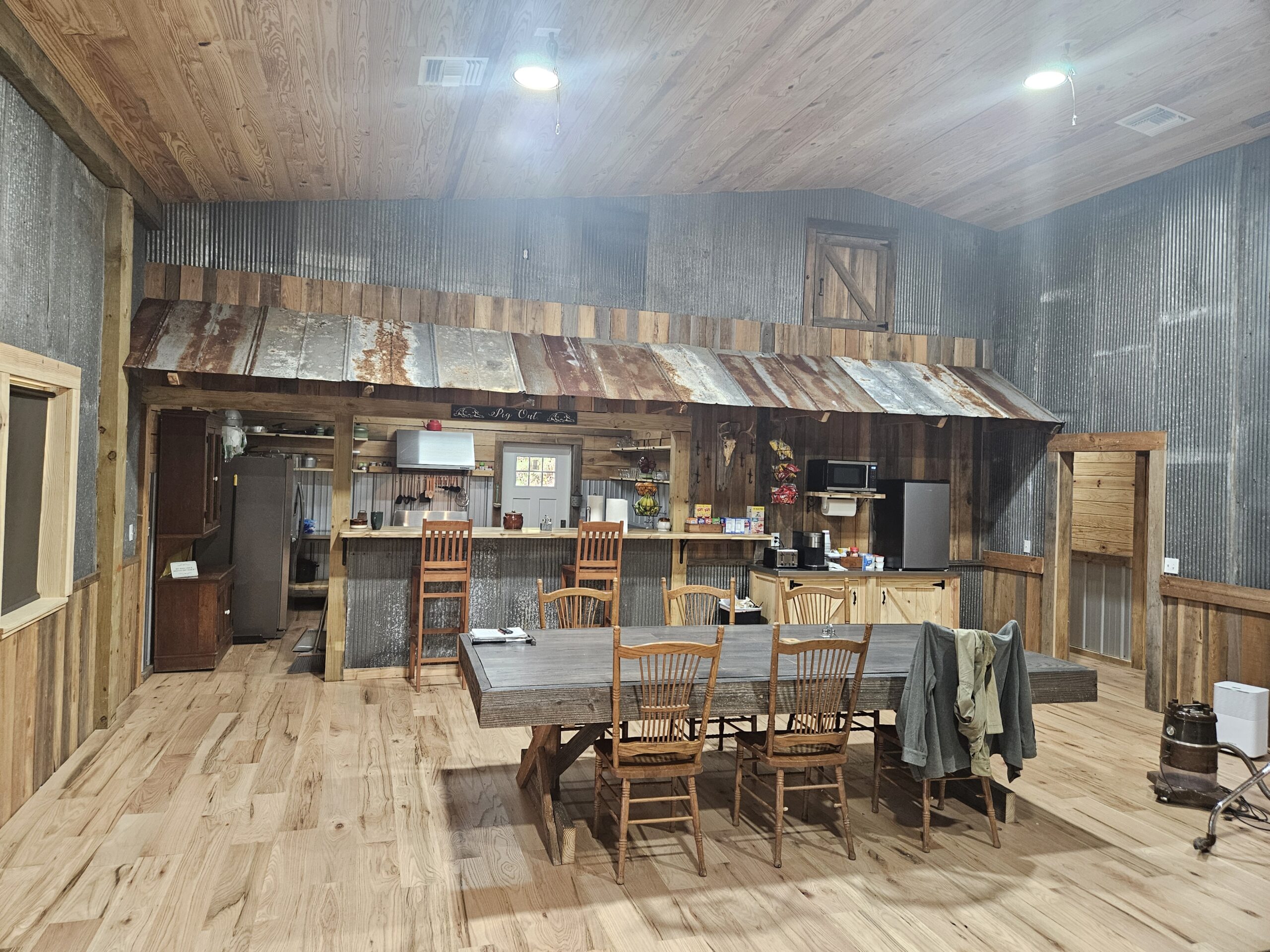 Rustic Lodge Kitchen and Dining Area with a Long Wooden Table